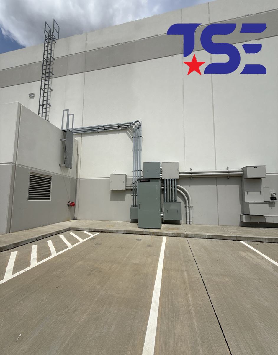 Exterior electrical service and conduit runs on a commercial building