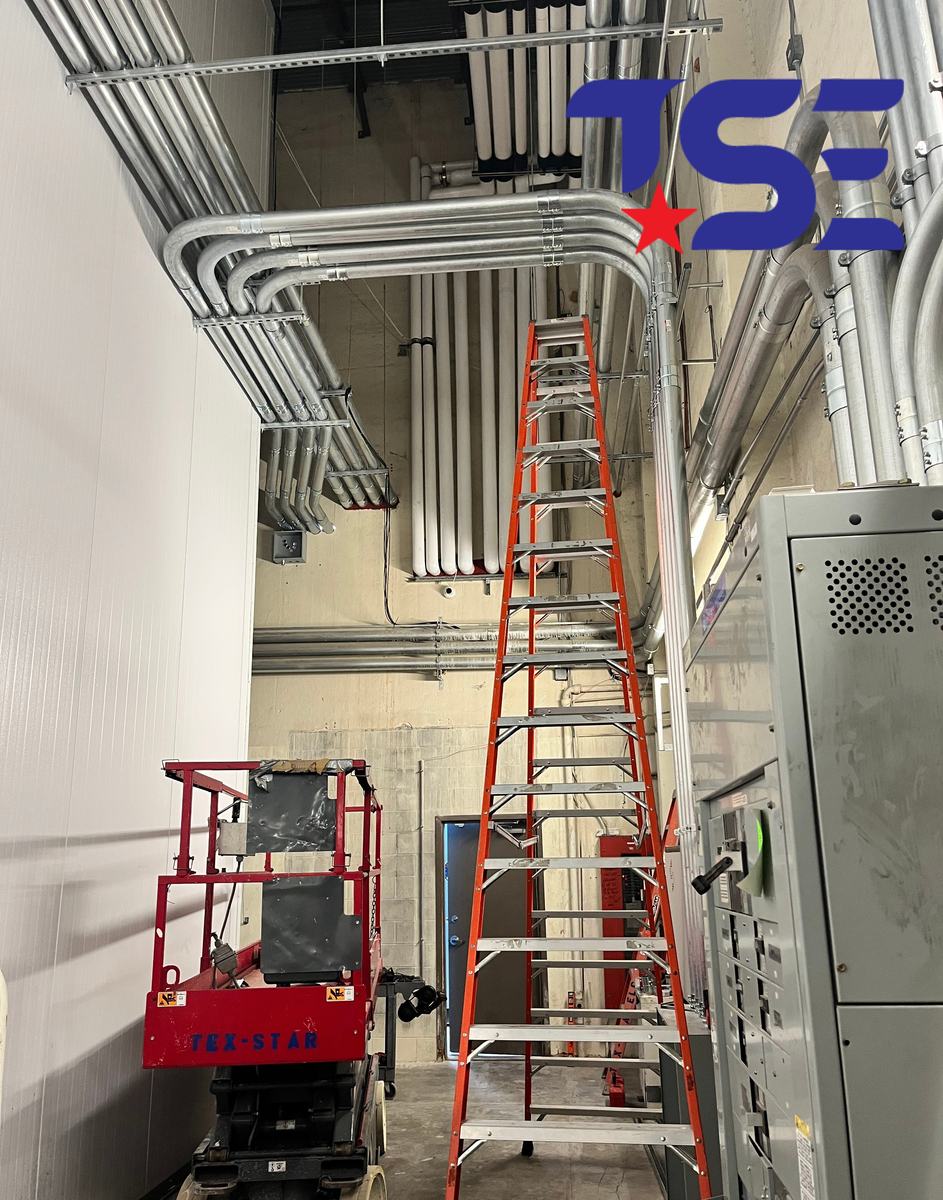 Overhead conduit runs in a commercial electrical room