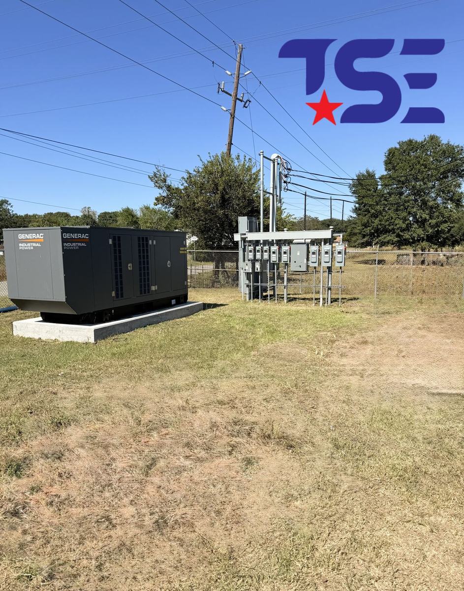 Generac industrial generator on a concrete pad beside utility service